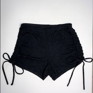 Black shorts with strings for a bow
